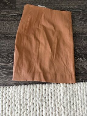 Kookai Mini Skirt in Warm Tan Leather-Look
Never worn. 
AU 36